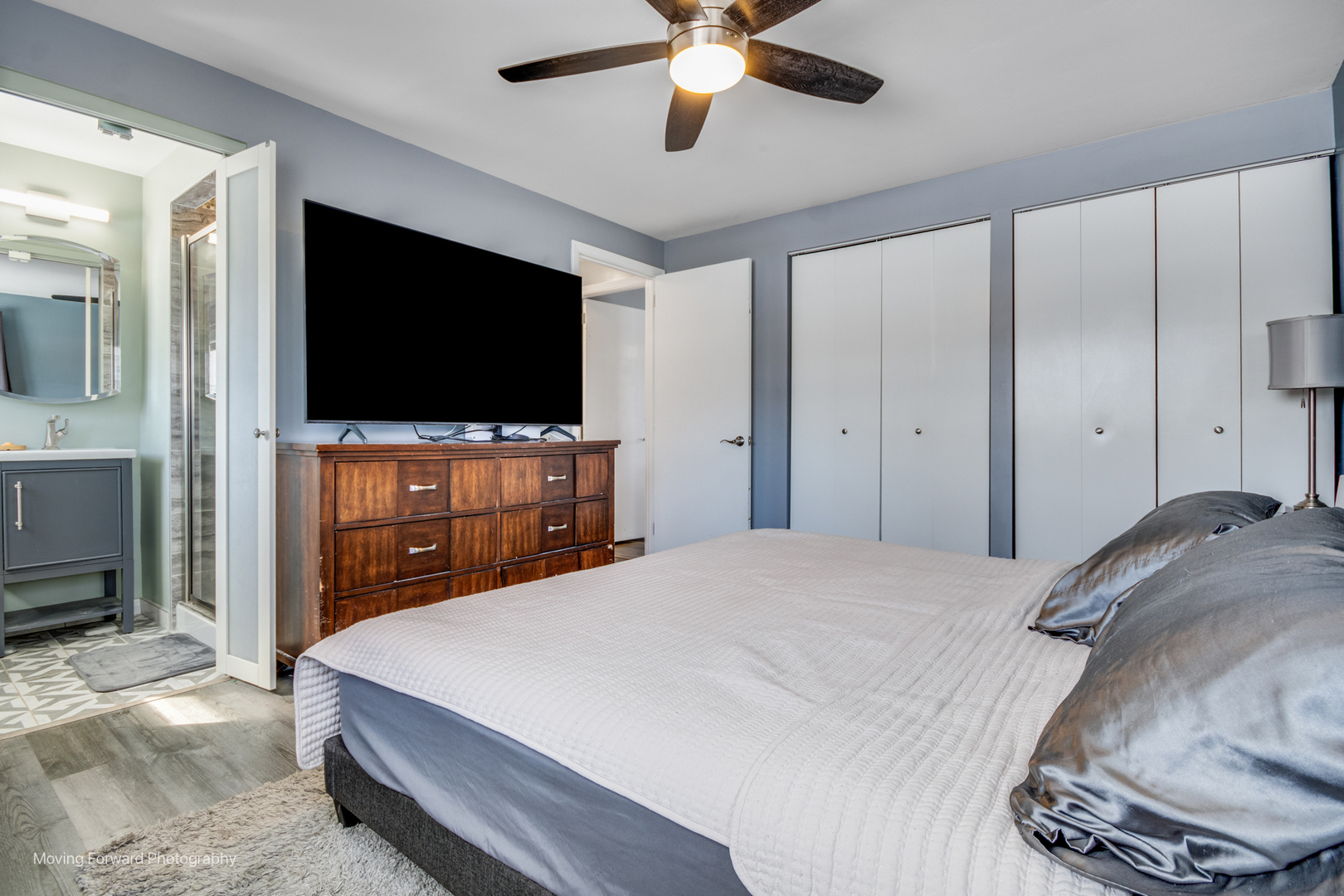 214 Springinsguth Road Schaumburg, IL 60193 - Photo 11 of 29 a bedroom with a bed and a flat screen tv