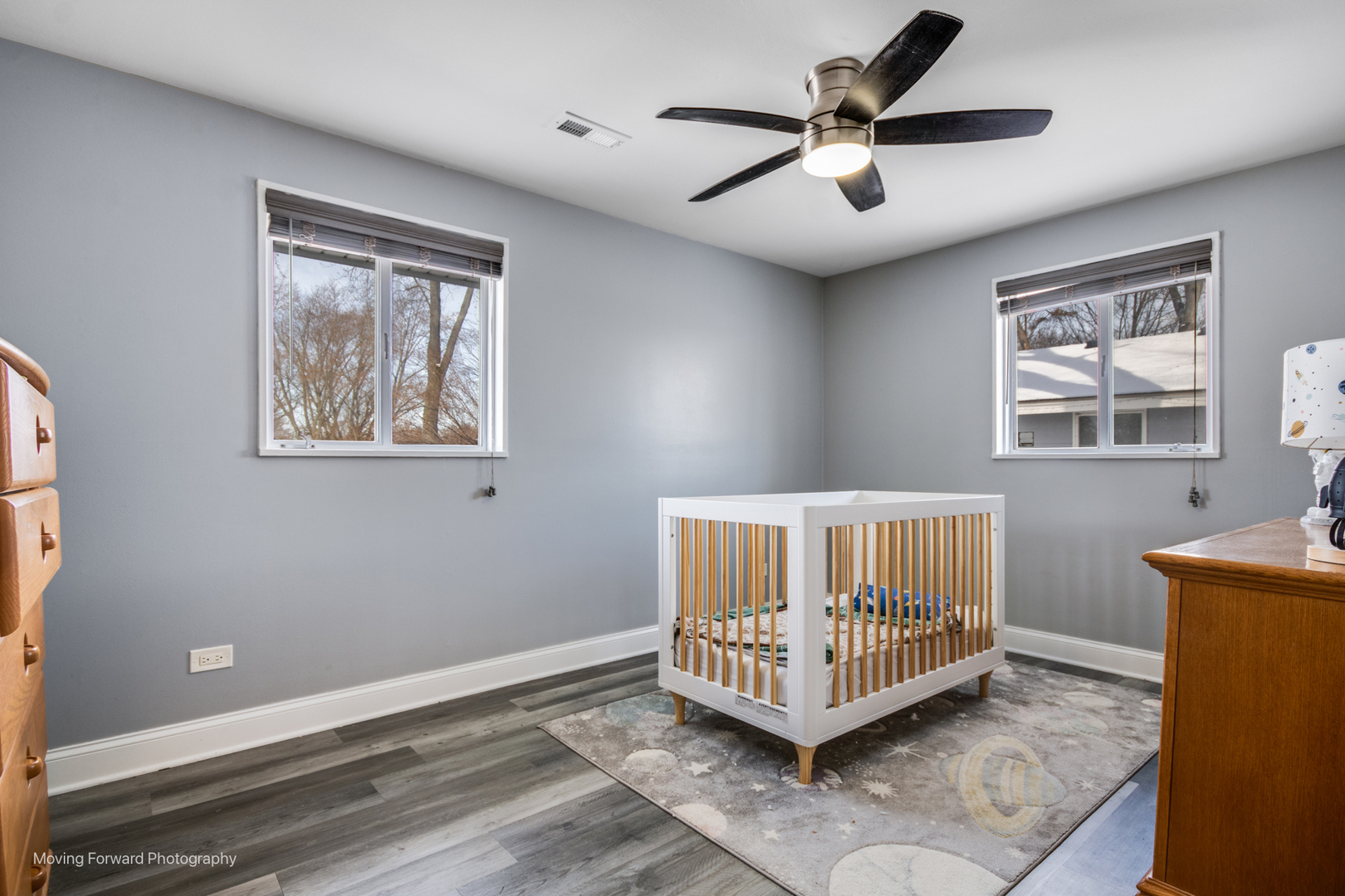 214 Springinsguth Road Schaumburg, IL 60193 - Photo 14 of 29 a living room with a bed furniture chandelier and a window