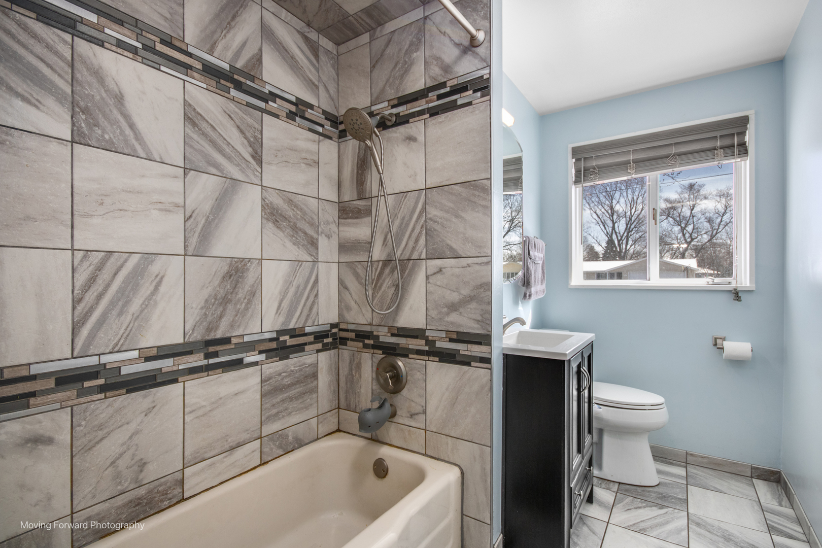 214 Springinsguth Road Schaumburg, IL 60193 - Photo 16 of 29 a bathroom with a toilet a sink and mirror