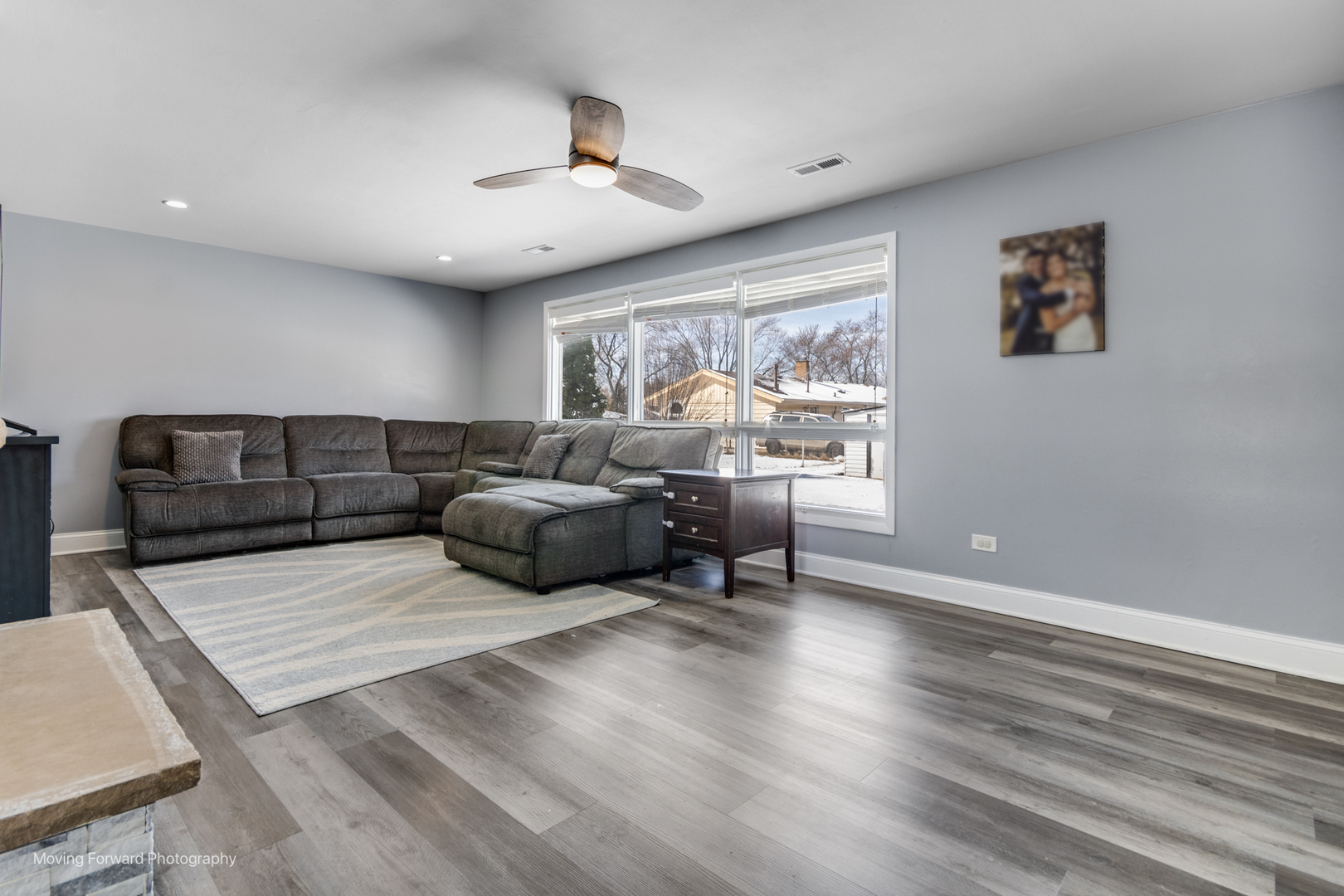 214 Springinsguth Road Schaumburg, IL 60193 - Photo 18 of 29 a living room with furniture and a large window