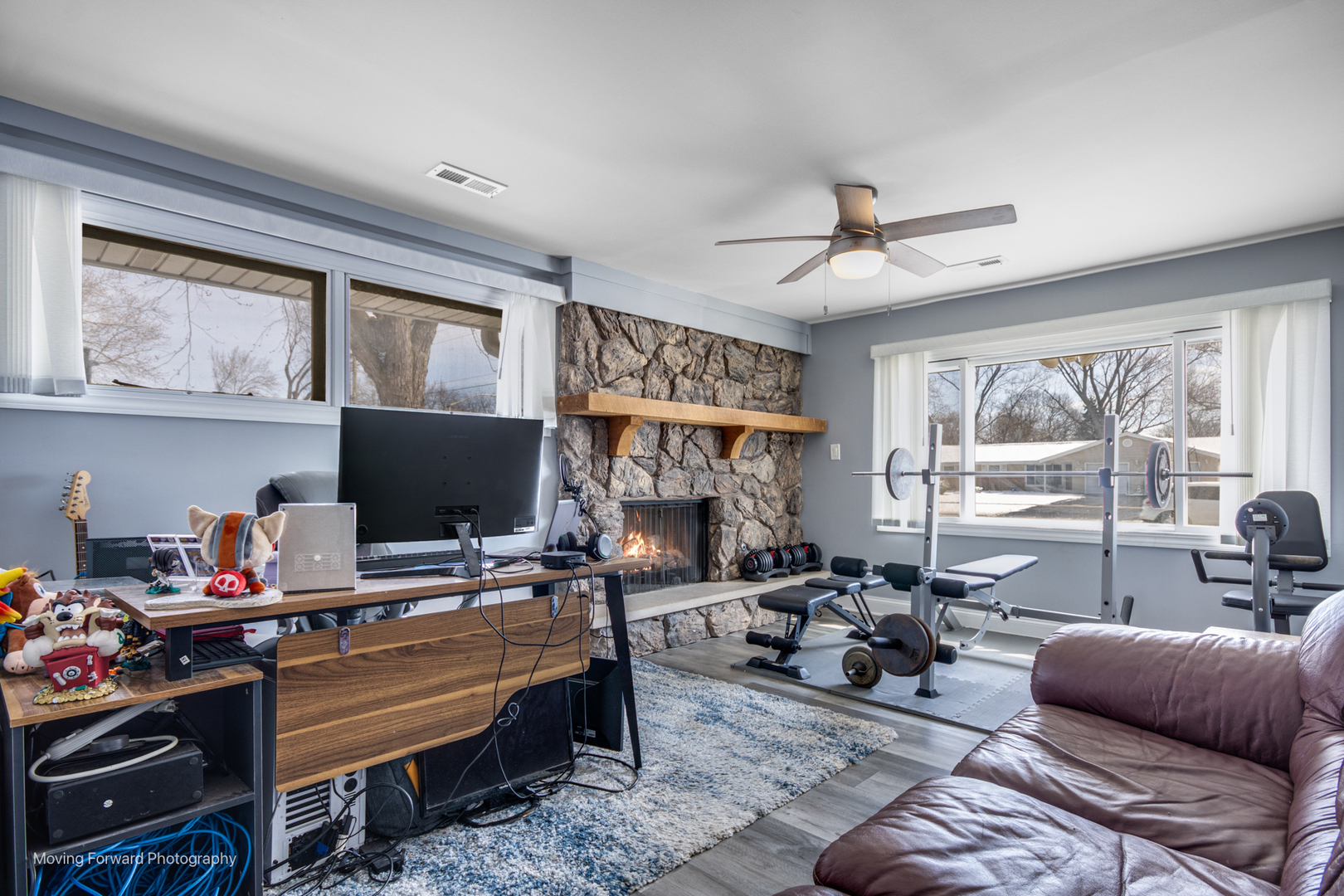 214 Springinsguth Road Schaumburg, IL 60193 - Photo 24 of 29 a living room with furniture a flat screen tv and floor to ceiling window