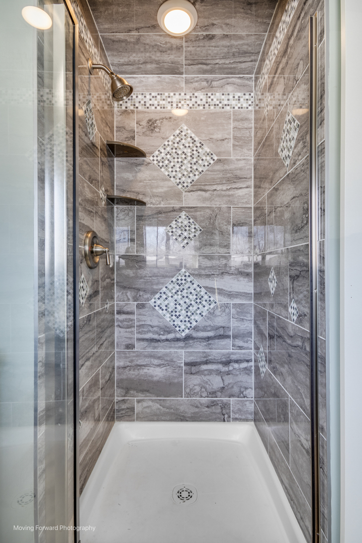 214 Springinsguth Road Schaumburg, IL 60193 - Photo 10 of 29 a bathroom with a shower