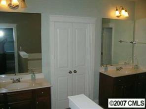 118 Mills Lane Fort Mill, SC 29708 - Photo 8 of 8 a bathroom with a sink and a mirror
