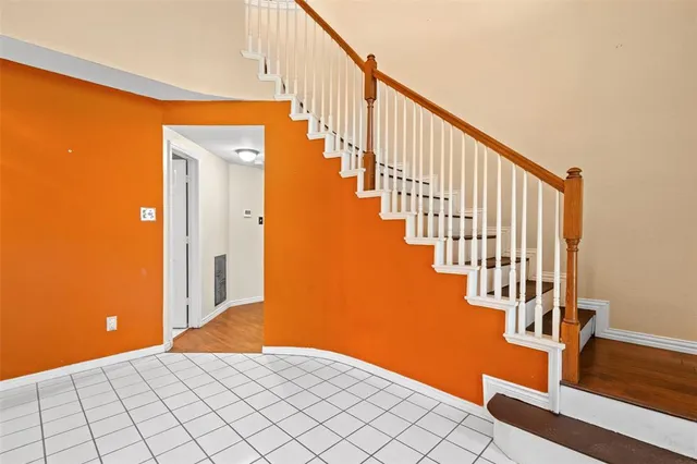 a view of an entryway with wooden floor