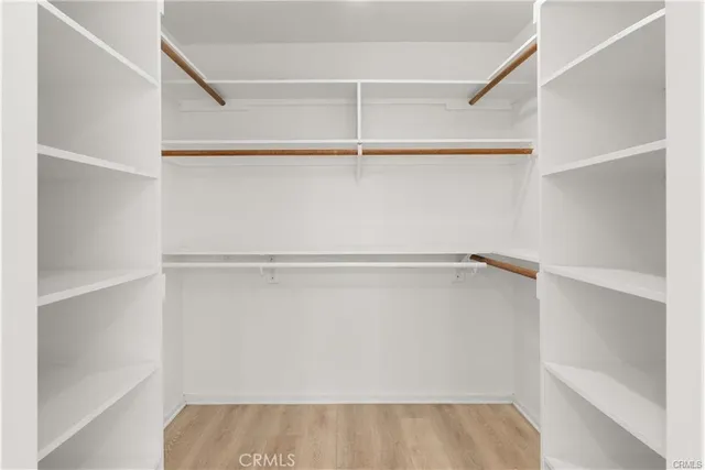 a view of an empty walk in closet