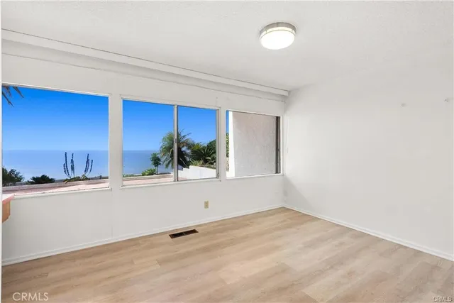 a view of a kitchen with a sink and cabinets