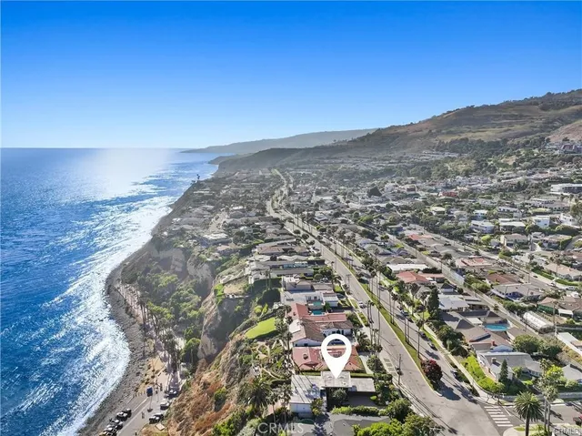 an aerial view of residential building and ocean view