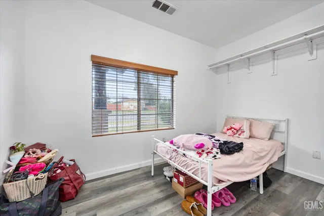 a bedroom with a bed and a table