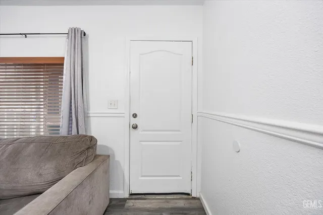 a living room with a couch and a window