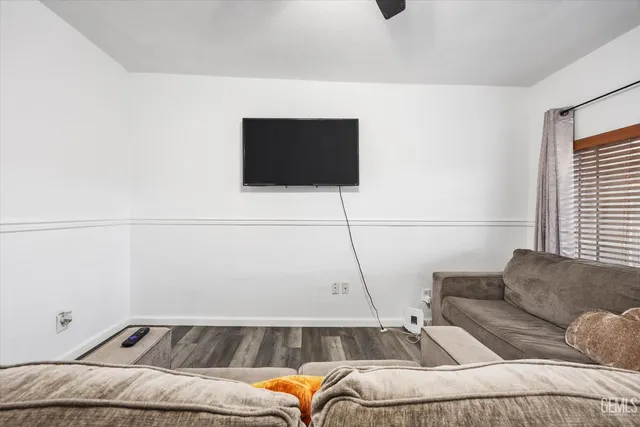a living room with a couch and a flat screen tv