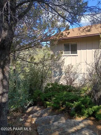 a backyard of a house with lots of green space