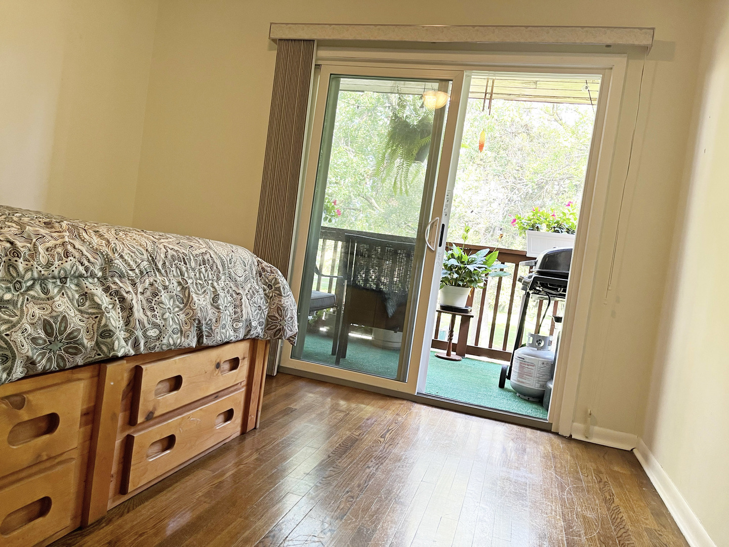 736 Dempster Street, Unit 110 Mount Prospect, IL 60056 - Photo 13 of 20 a bedroom with a bed and wooden floor