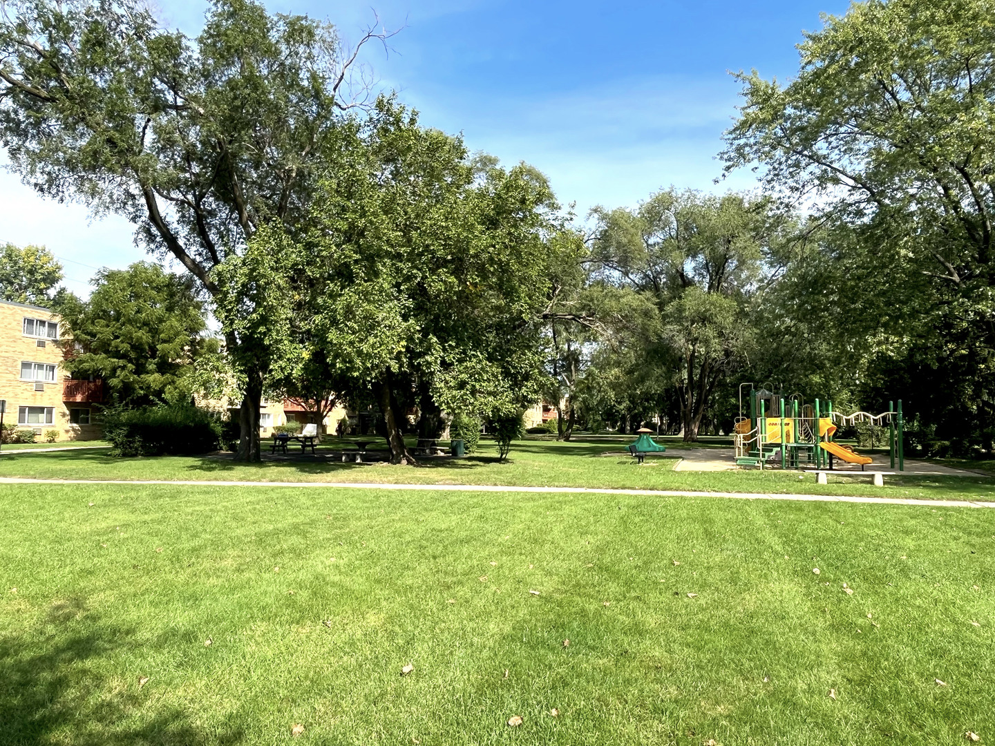 736 Dempster Street, Unit 110 Mount Prospect, IL 60056 - Photo 15 of 20 a view of a big yard with a trees