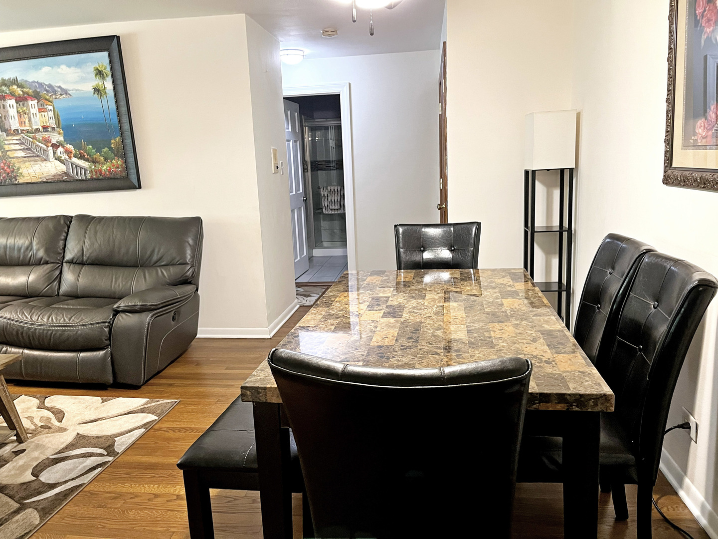 736 Dempster Street, Unit 110 Mount Prospect, IL 60056 - Photo 5 of 20 a living room with furniture and wooden floor