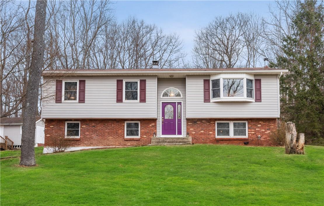 front view of a house with a yard