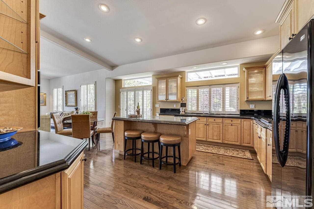 4370 Juniper Trail Reno, NV 89519 - Photo 13 of 40 a view of a dining room with furniture and wooden floor