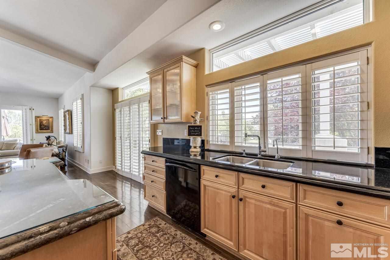4370 Juniper Trail Reno, NV 89519 - Photo 14 of 40 a kitchen with large windows sink and cabinets