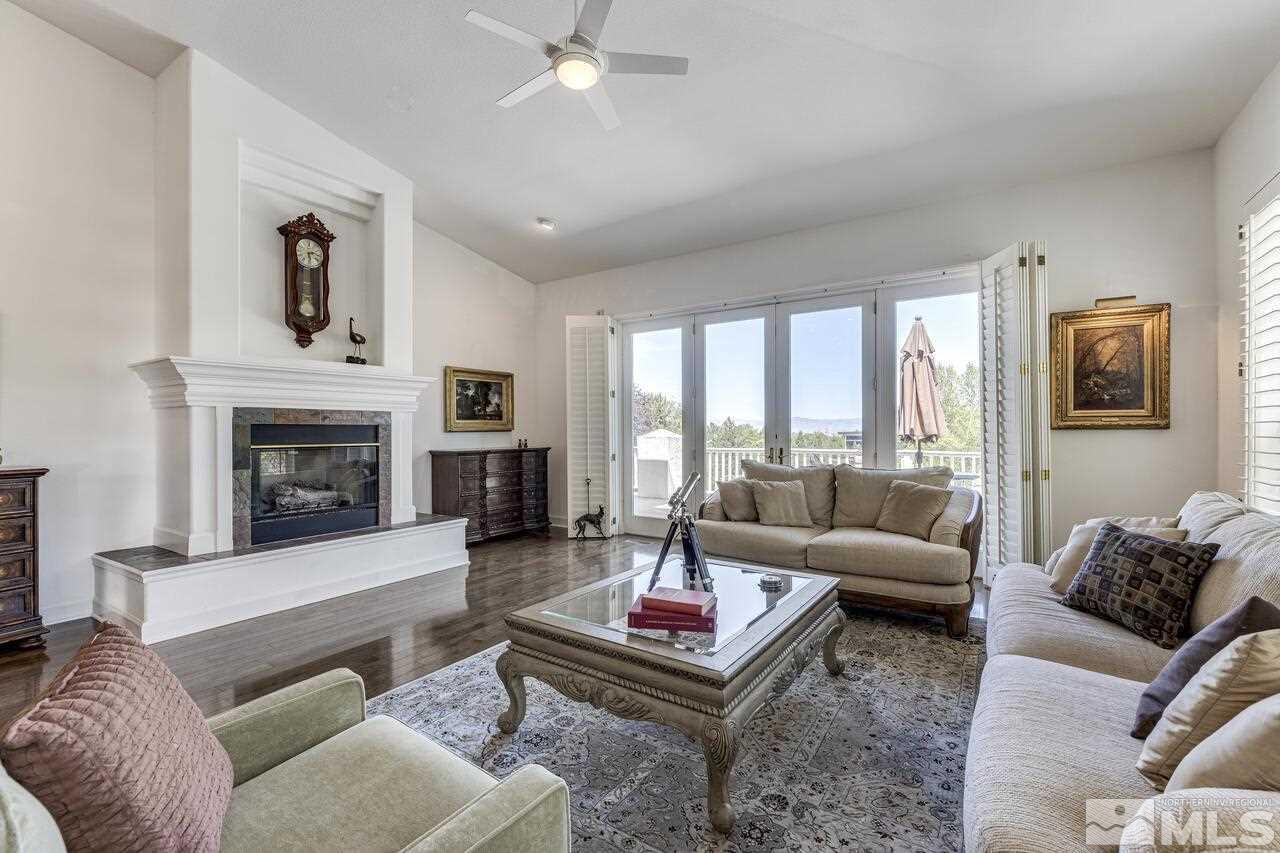 4370 Juniper Trail Reno, NV 89519 - Photo 19 of 40 a living room with furniture and a fireplace