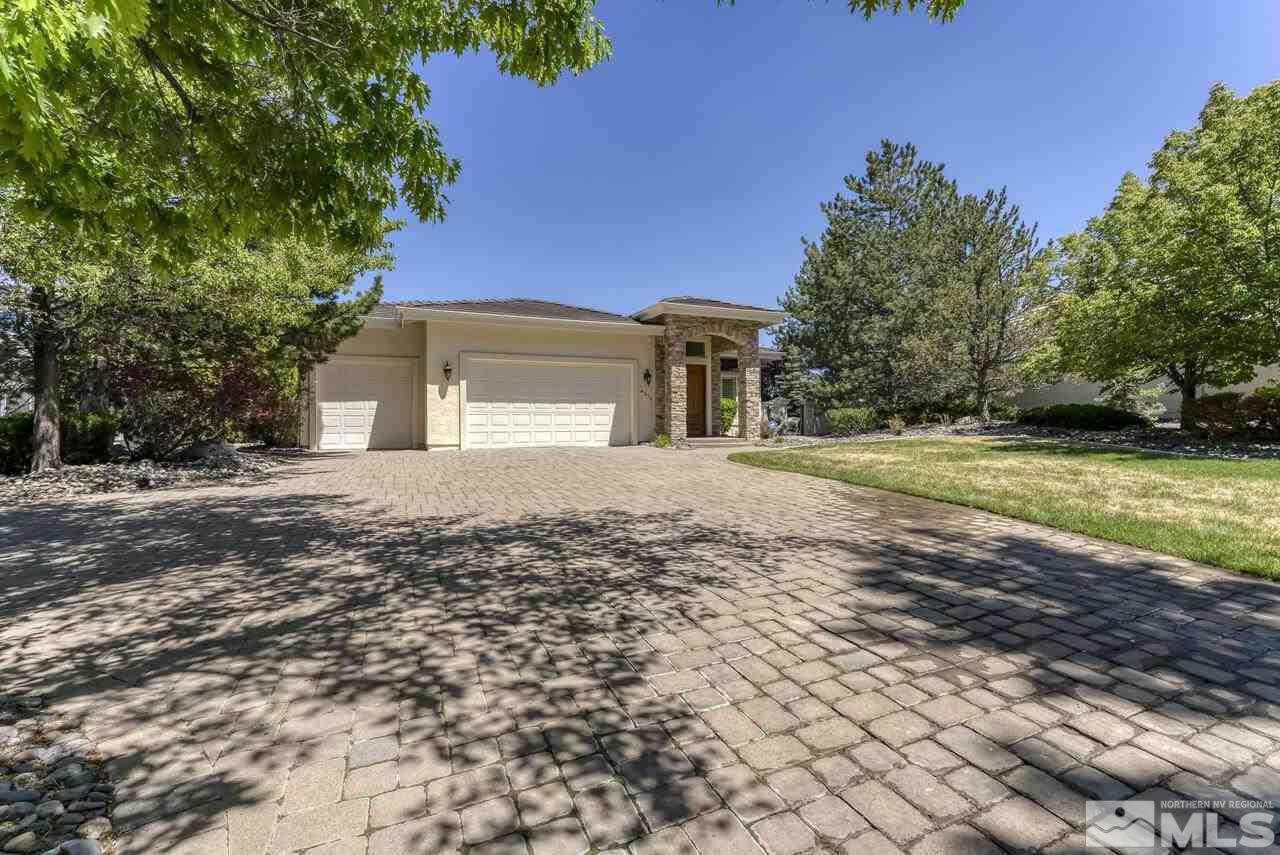 4370 Juniper Trail Reno, NV 89519 - Photo 2 of 40 a front view of a house with a yard