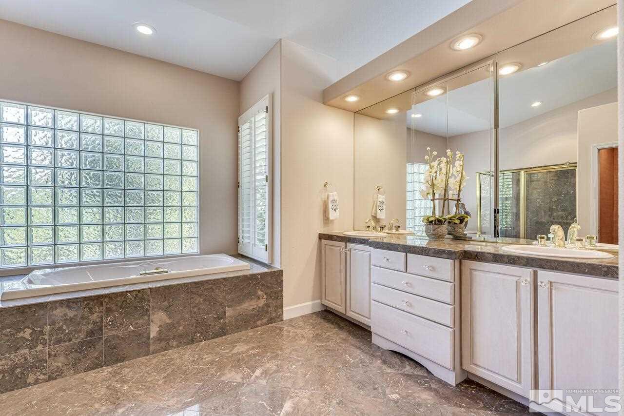 4370 Juniper Trail Reno, NV 89519 - Photo 26 of 40 a spacious bathroom with a large tub and shower