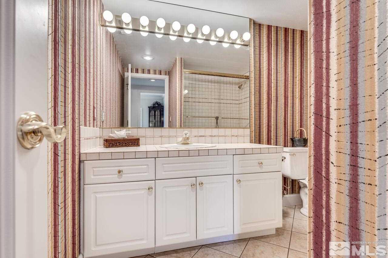 4370 Juniper Trail Reno, NV 89519 - Photo 33 of 40 a bathroom with a double vanity sink and a mirror