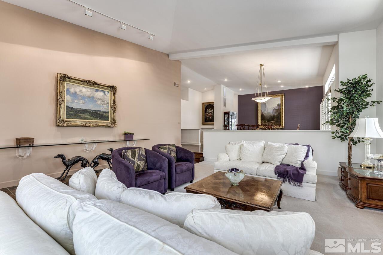 4370 Juniper Trail Reno, NV 89519 - Photo 8 of 40 a living room with furniture kitchen view and a chandelier