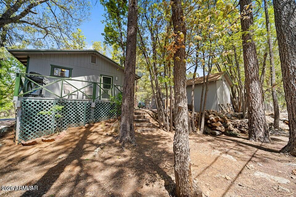 5801 Apache Trail Pinetop, AZ 85935 - Photo 20 of 39 a view of a house with a yard