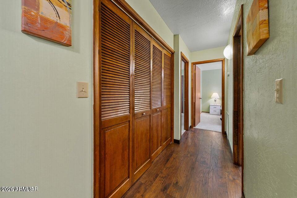 5801 Apache Trail Pinetop, AZ 85935 - Photo 22 of 39 a view of a hallway with wooden floor