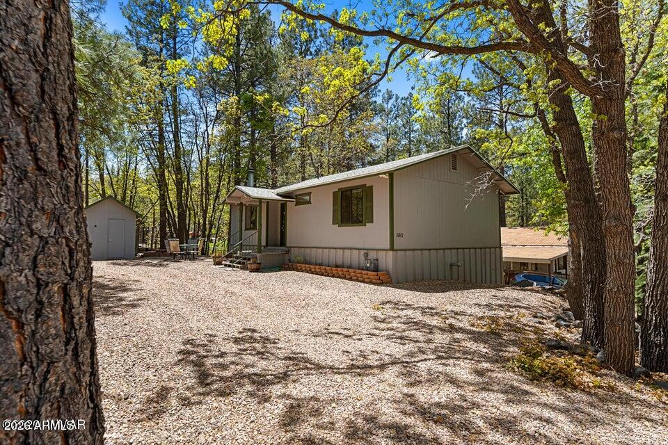5801 Apache Trail Pinetop, AZ 85935 - Photo 3 of 39 a house is covered with snow in front of house