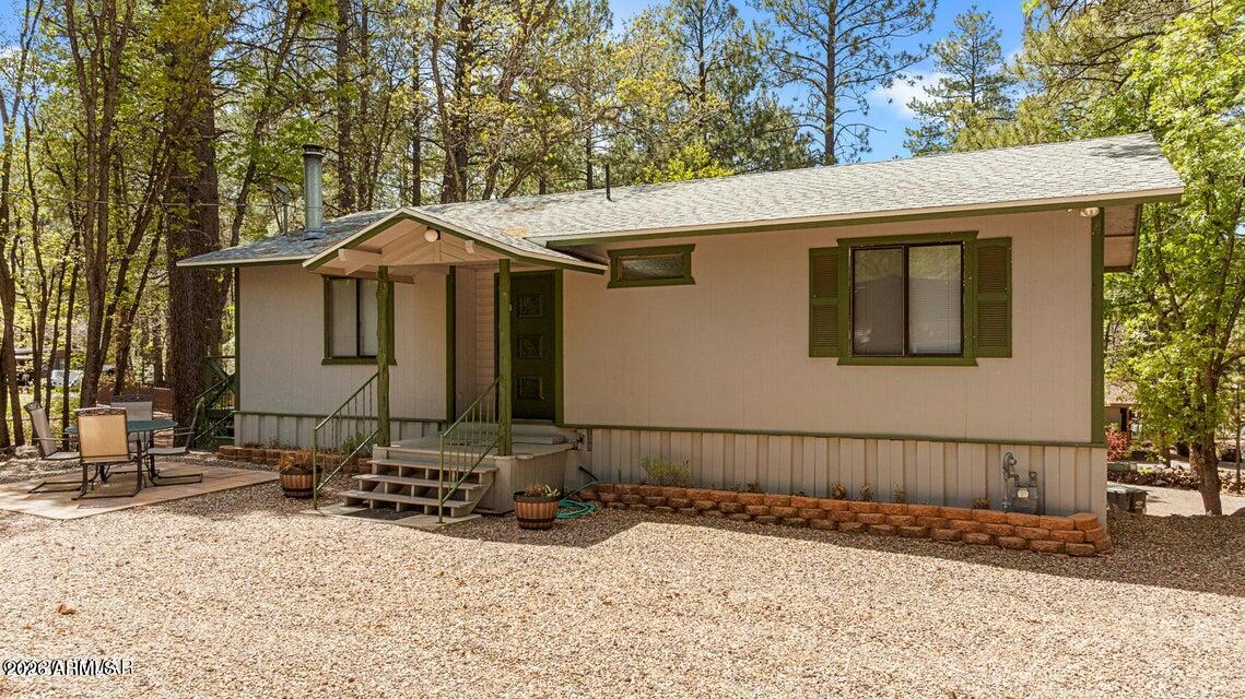 5801 Apache Trail Pinetop, AZ 85935 - Photo 31 of 39 a front view of a house with a yard