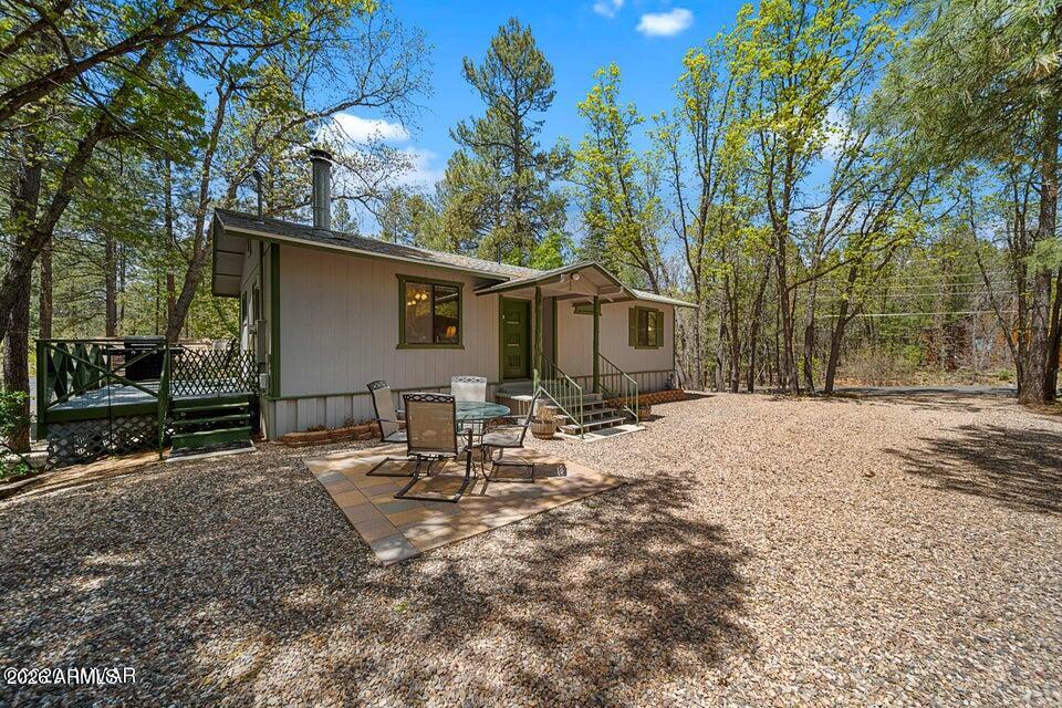 5801 Apache Trail Pinetop, AZ 85935 - Photo 5 of 39 a view of a house with backyard and sitting area
