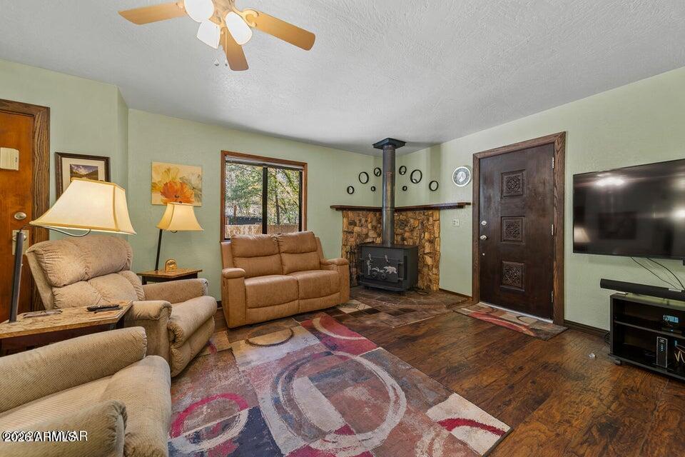 5801 Apache Trail Pinetop, AZ 85935 - Photo 9 of 39 a living room with furniture and a flat screen tv