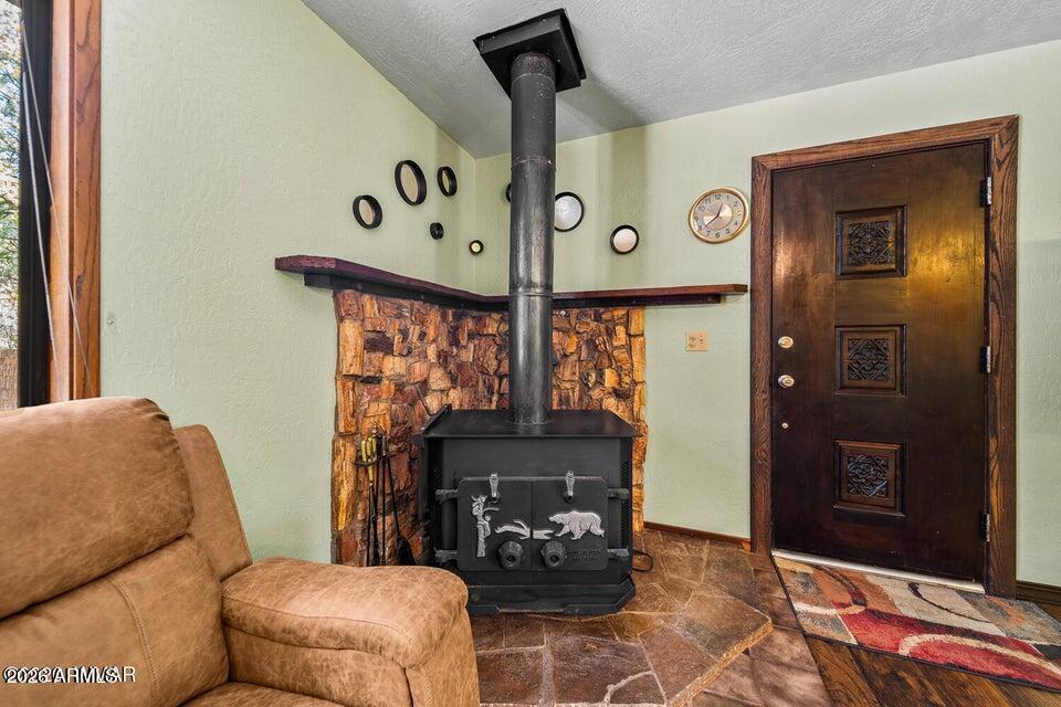 5801 Apache Trail Pinetop, AZ 85935 - Photo 10 of 39 a living room with furniture and a fireplace
