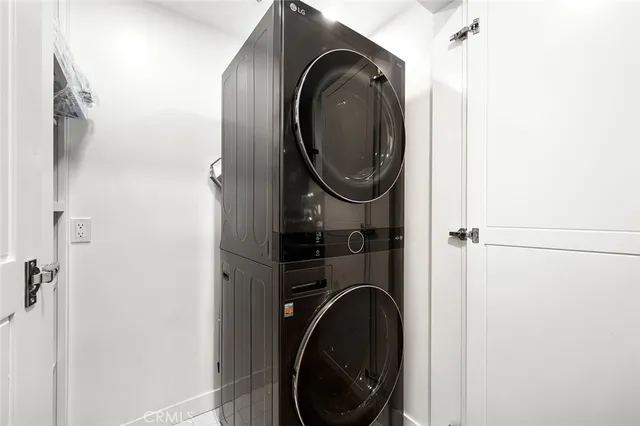 a close view of a utility room with dryer and washer