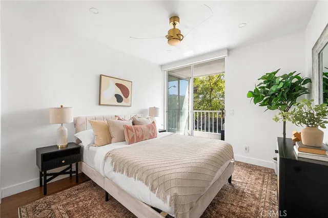 a bedroom with bed and a window