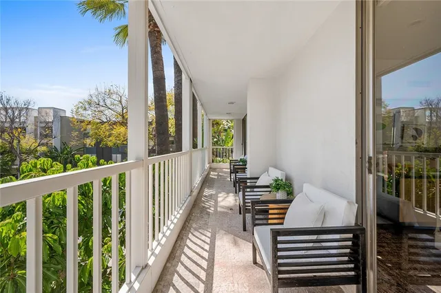 a view of balcony with furniture