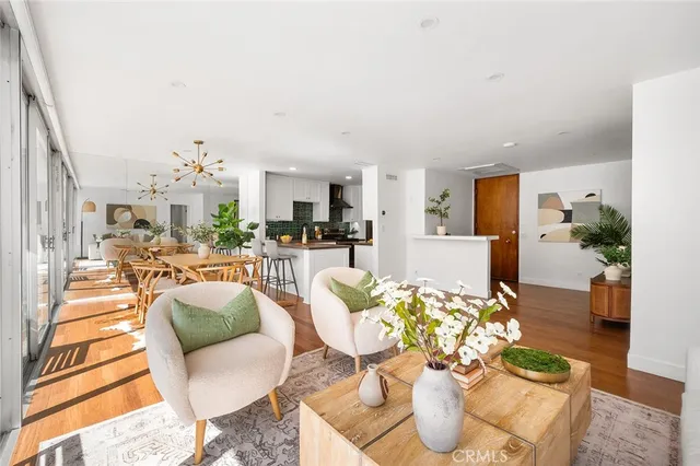 a living room with fireplace furniture and a wooden floor