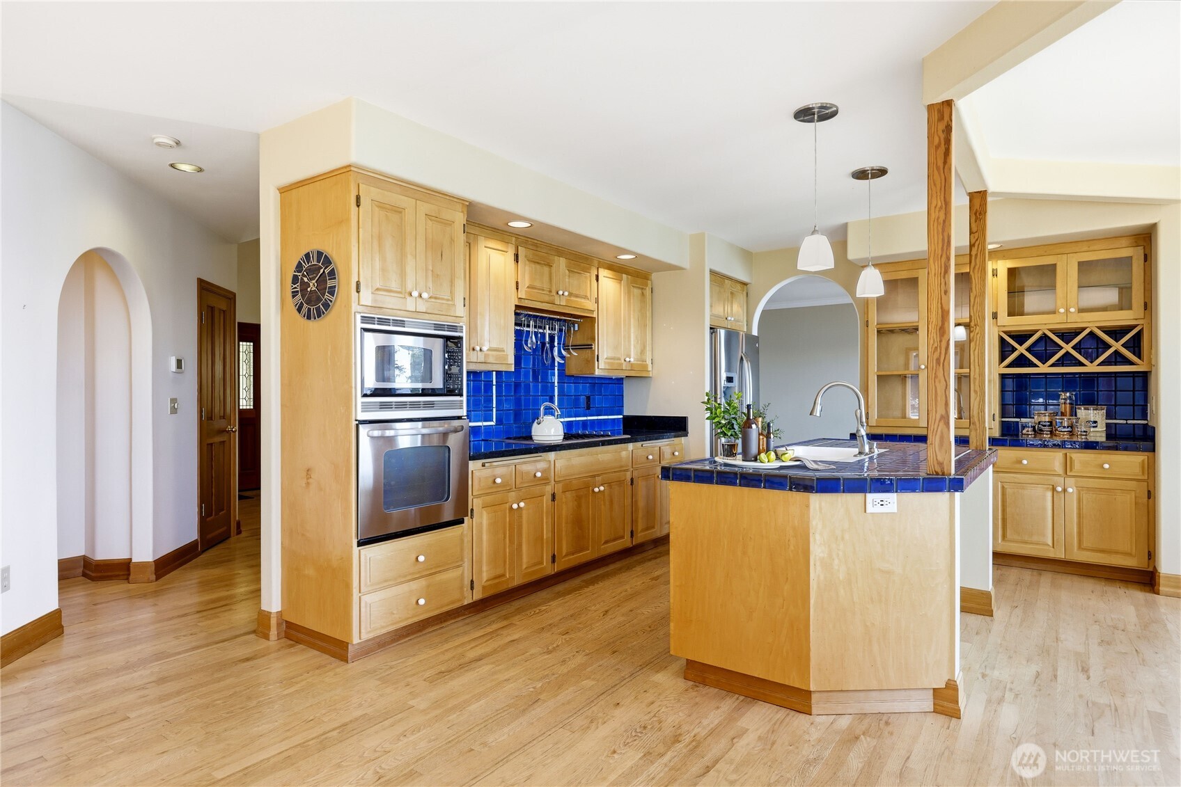 252 Jansen Road Nordland, WA 98358 - Photo 10 of 40 a kitchen with stainless steel appliances granite countertop a stove and a refrigerator