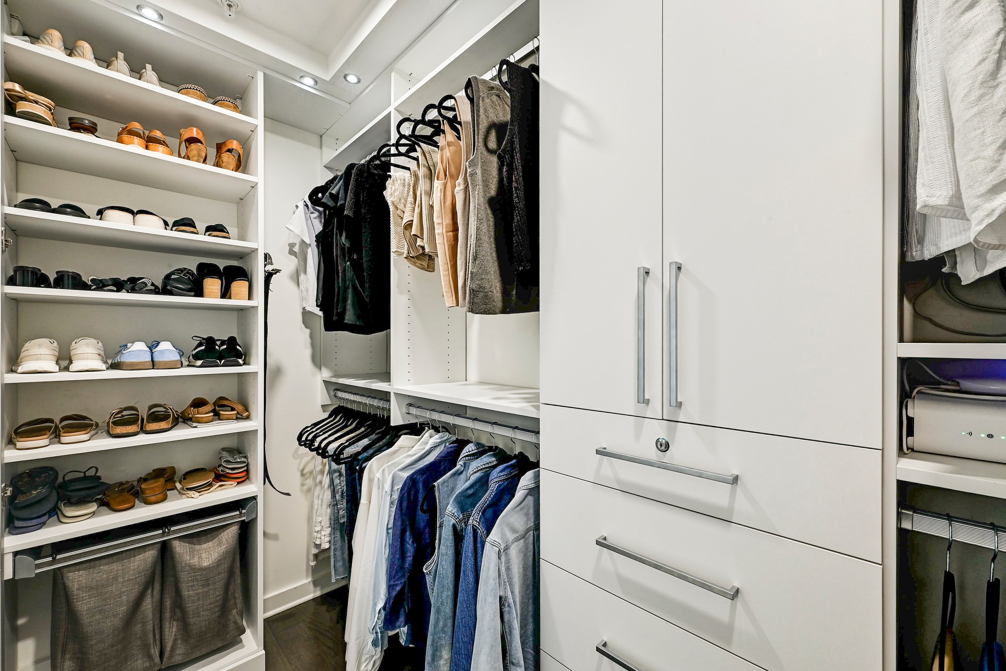 2003 Wilson Street, Unit 1 Austin, TX 78704 - Photo 21 of 40 Closet designed by California Closet. Also has private and a secure jewelry drawer. Full length mirror and shelving for shoes and clothes hamper.