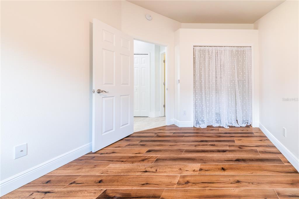 3862 Beacon Ridge Way Clermont, FL 34711 - Photo 40 of 56 a bedroom with a bed and a window