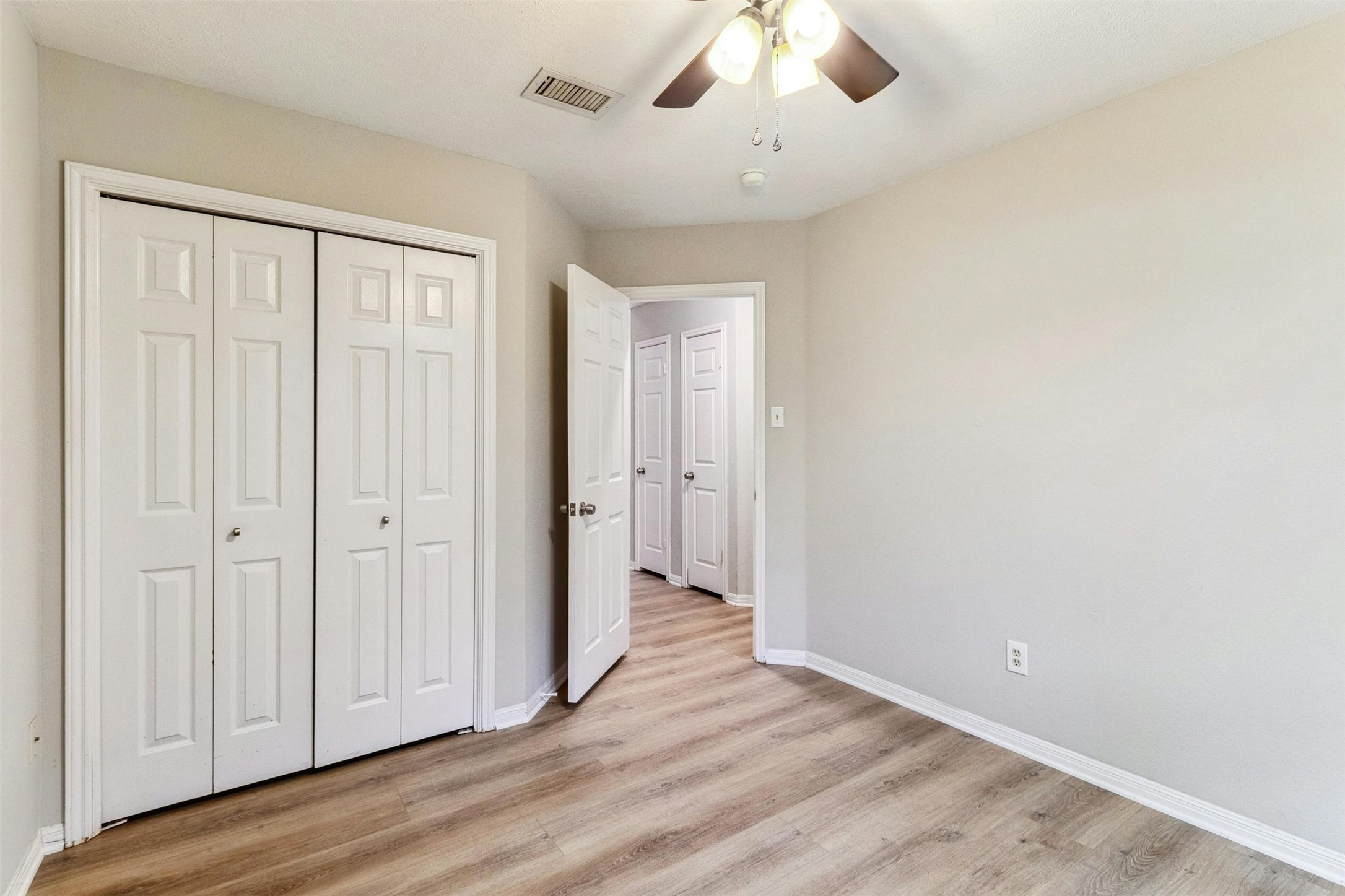 5905 Shanghai Pierce Road Austin, TX 78749 - Photo 14 of 21 an empty room with wooden floor and windows