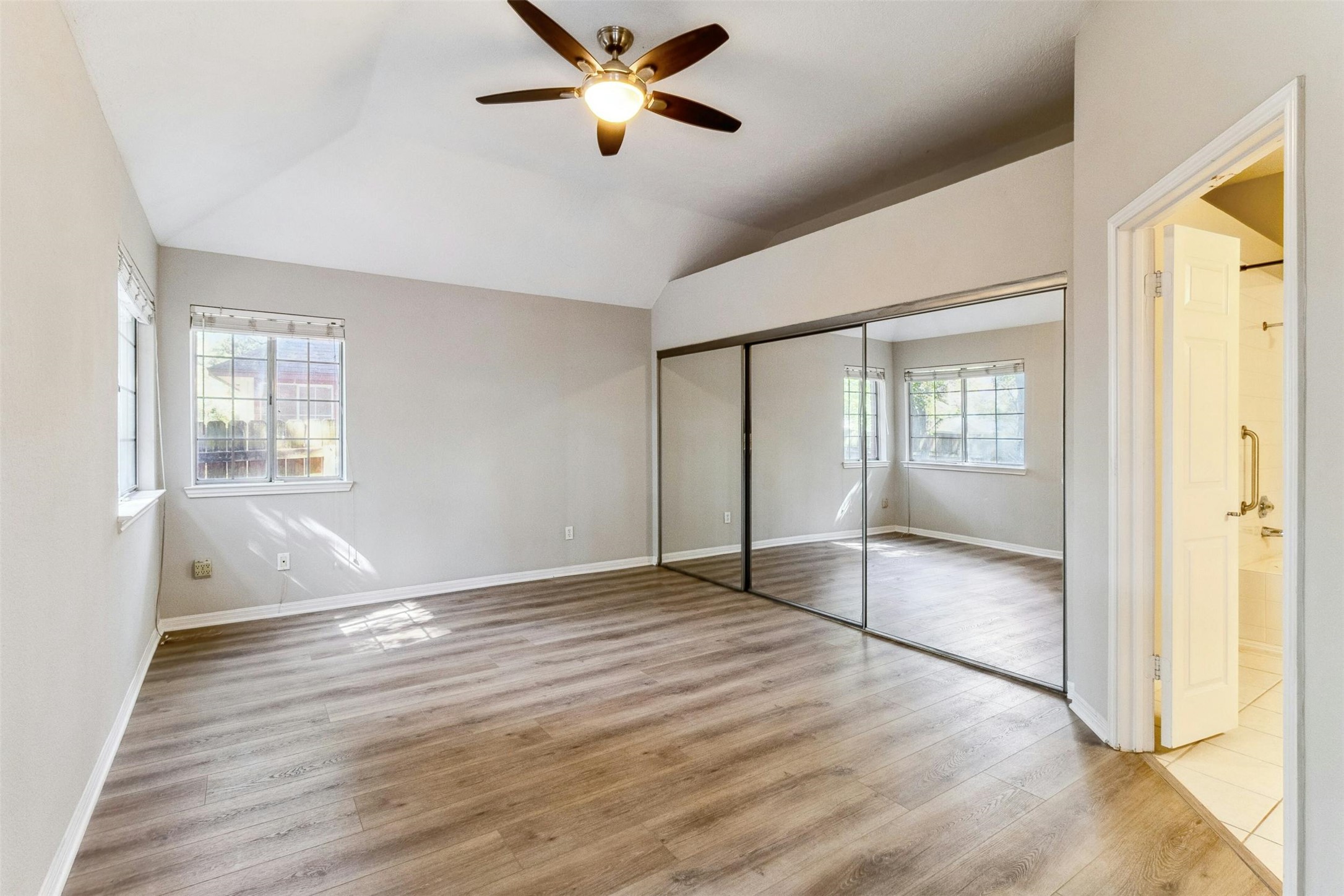5905 Shanghai Pierce Road Austin, TX 78749 - Photo 15 of 21 a view of empty room with wooden floor and fan