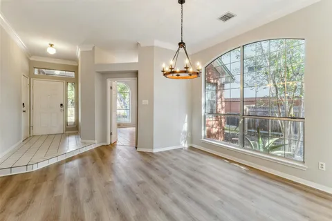 a view of livingroom with furniture wooden floor wooden floor and windows