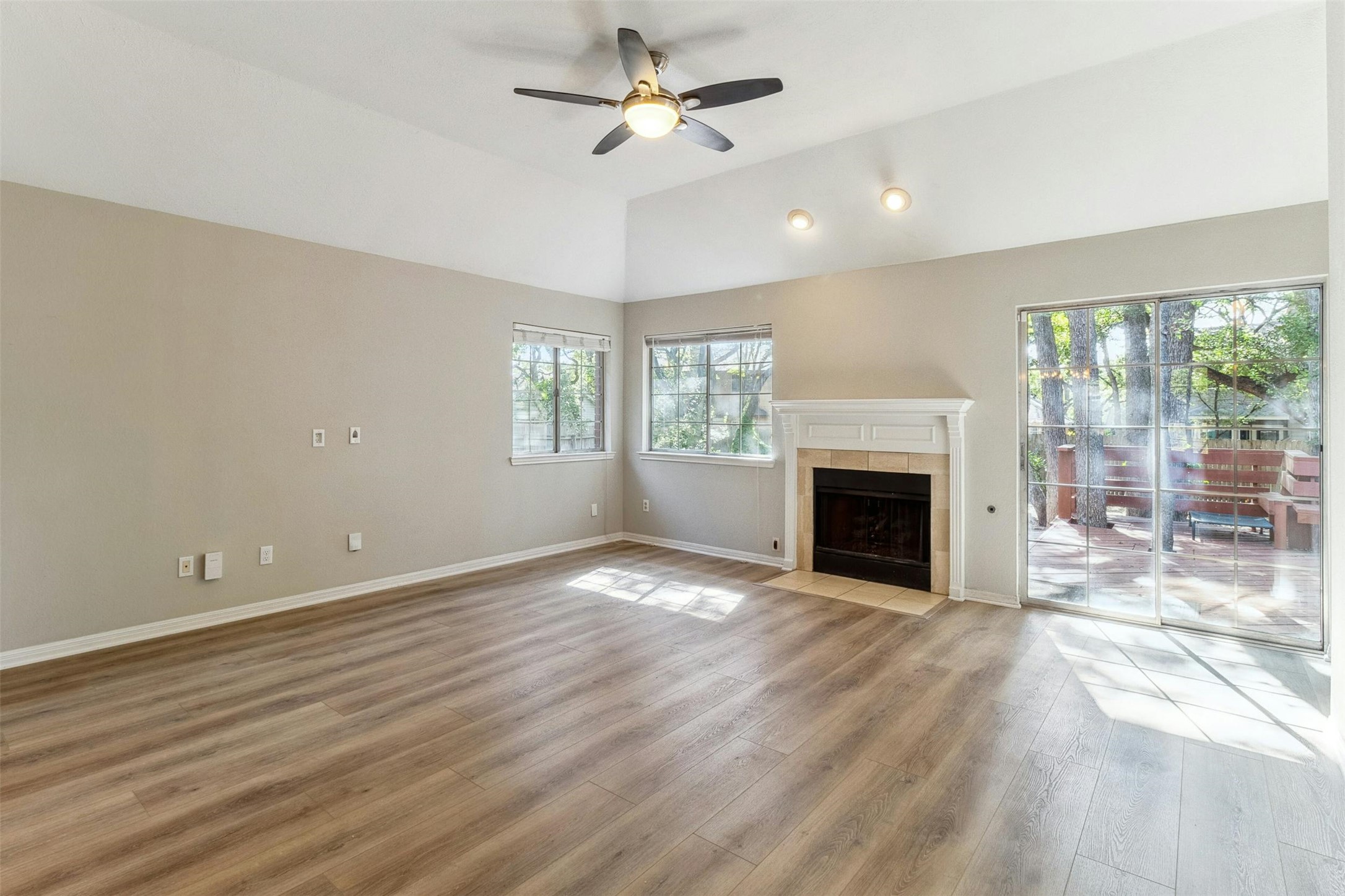 5905 Shanghai Pierce Road Austin, TX 78749 - Photo 6 of 21 a view of empty room with fireplace and wooden floor