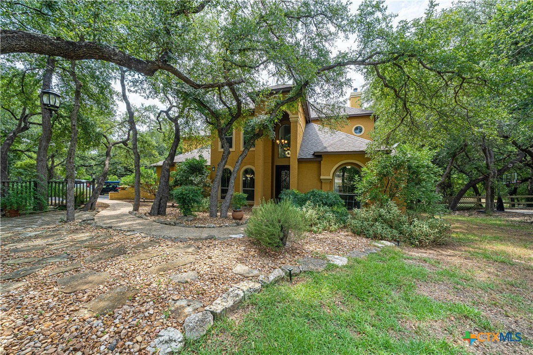 519 Long Meadow Spring Branch, TX 78070 - Photo 3 of 33 a view of a big yard with plants and large trees