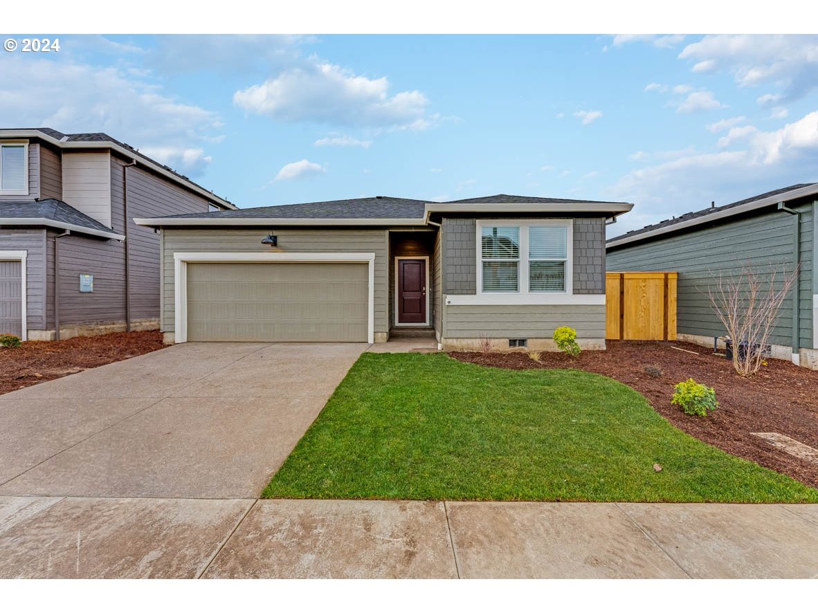 2678 V Springfield, OR 97477 - Photo 1 of 20 a front view of a house with a yard and garage
