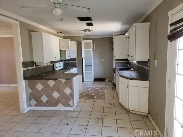 a kitchen with a sink and cabinets