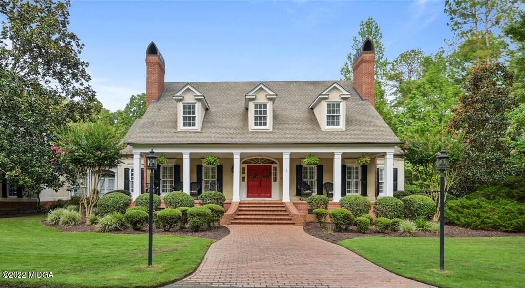 7959 Whittle Road Macon, GA 31220 - Photo 2 of 49 a front view of a house with garden and porch