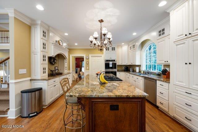 7959 Whittle Road Macon, GA 31220 - Photo 22 of 49 a kitchen with sink stove and cabinets