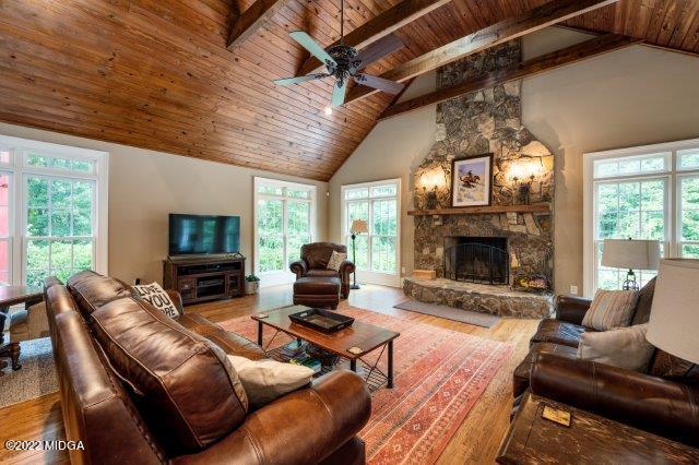 7959 Whittle Road Macon, GA 31220 - Photo 29 of 49 a living room with furniture a fireplace and a flat screen tv